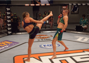 Rose Namajunas (left) kicking at Joanne Calderwood. Pic courtesy of UFC/Zuffa LLC.